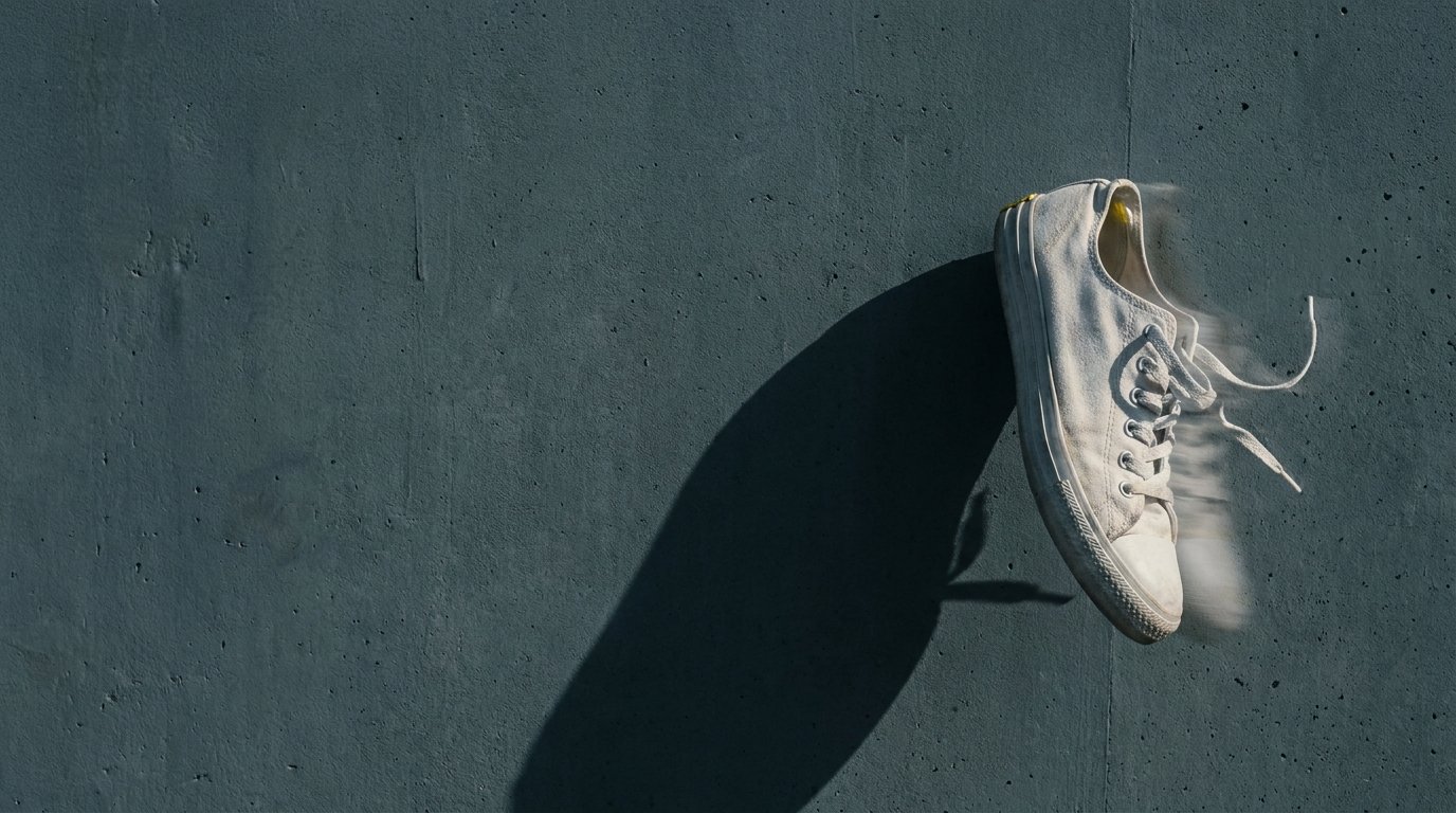 A single white sneaker mid-stride.